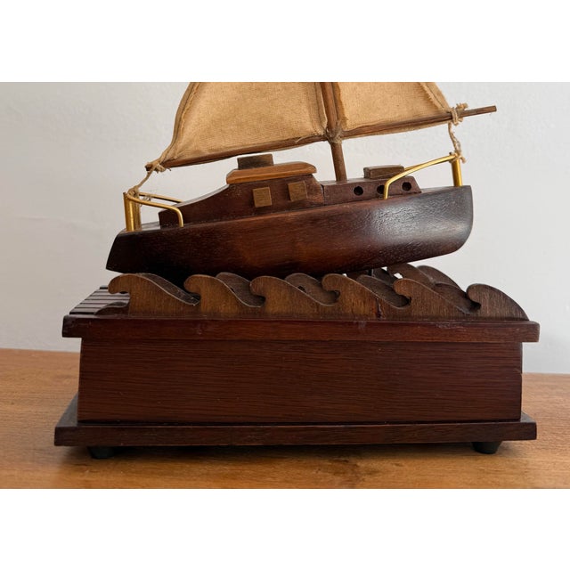 Wooden midcentury nautical music box found in Cape Cod with a sailboat that rolls on the waves and plays a pretty, but...