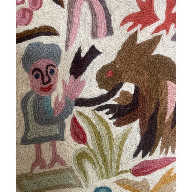 This is a Mid Century vintage hand woven wool tapestry from South America. It has burlap backing and features demon...