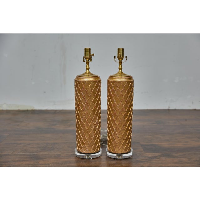 A pair of 19th century French architectural fragments made into table lamps. Crafted from 19th-century French giltwood...