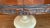 Two-Tone Round Pedestal Dining Table With Carved Apron and 22” Leaf For Sale In Boston - Image 6 of 7