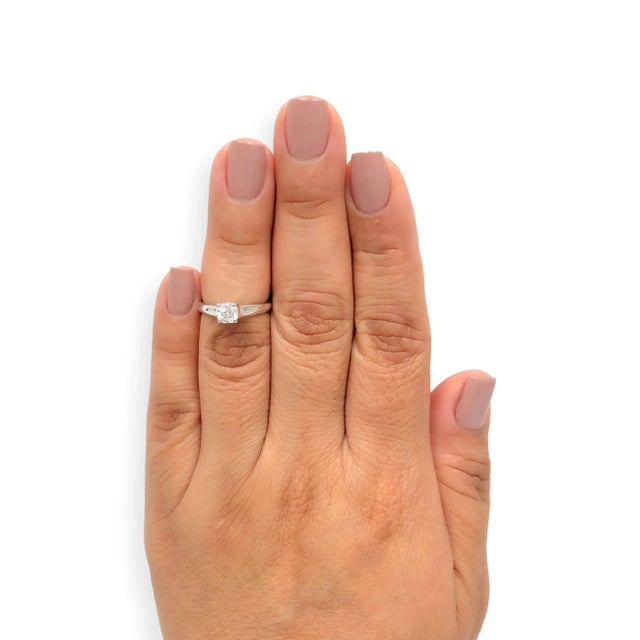 A Tiffany & Co. Lucida® engagement ring featuring a 0.54 ct Lucida cut diamond set in platinum. The diamond is graded G-H...