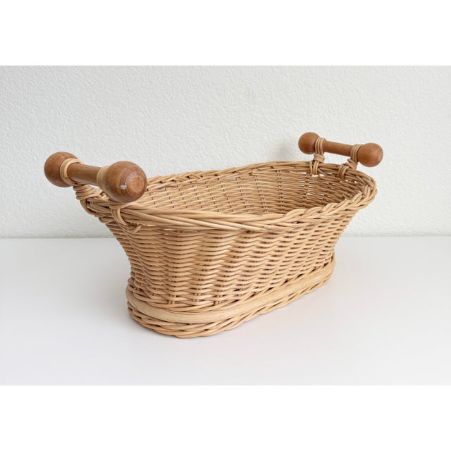 An early to mid-20th-century French boulangerie shop basket. This unique, handmade vintage basket features an oval woven...