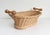 An early to mid-20th-century French boulangerie shop basket. This unique, handmade vintage basket features an oval woven...