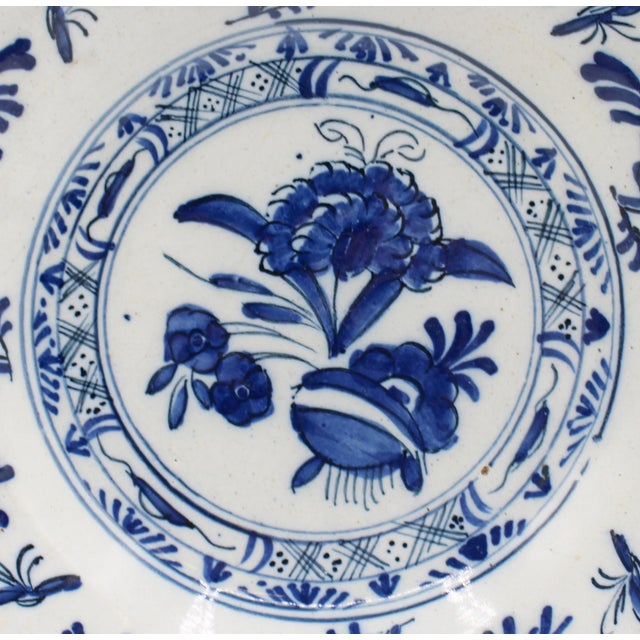 Circa 1780 pair of Delft yellow rim blue & white soup plates, Dutch. Floral design with yellow edge. The rim border has 4...