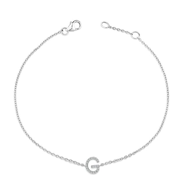 Immerse yourself in the understated elegance of this 10K white gold bracelet, rhodium-plated for an enrapturing shimmer...