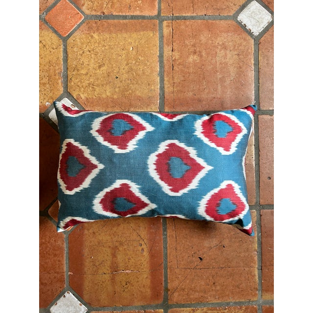 Handwoven Uzbeki Silk Ikat Pillow Cover. Gorgeous mix of blue, white, and red with a simple plain backing. Ikats are...