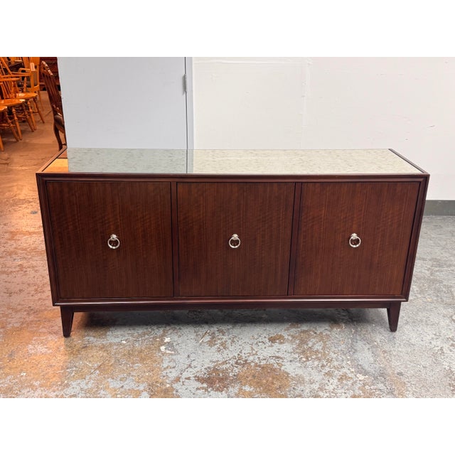 Design Plus Gallery presents the Heston Buffet from Ethan Allen. The buffet was crafted from Mozambique and mahogany...