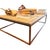 A substantial Restoration Hardware “Bookmaker” coffee table featuring a reclaimed plank-style wood top set within a...