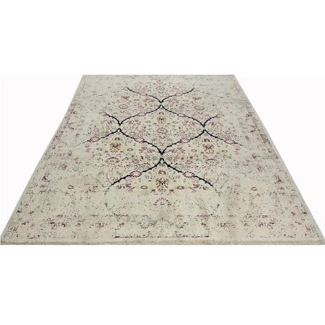 Traditional Shiraz Area Rug featuring an all-over design in a beige colored field enclosed in the same color border....