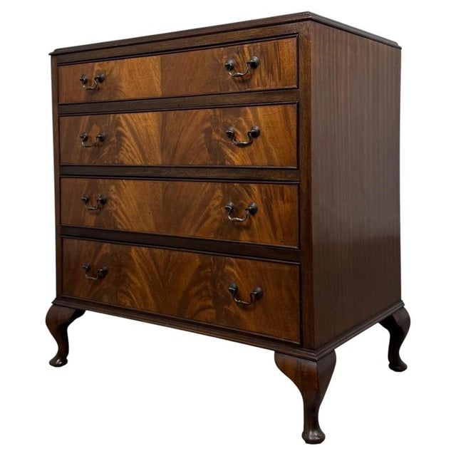 A beautifully proportioned 20th-century mahogany chest of drawers, combining timeless traditional styling, elegant...