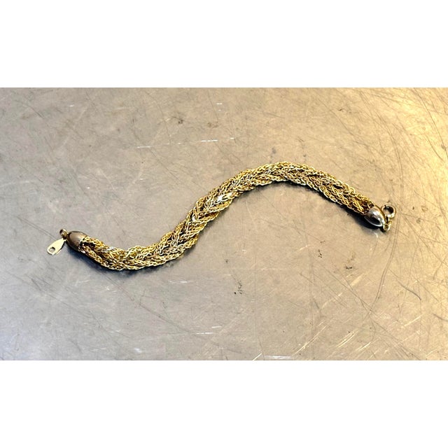 1970s gold tone braided metal bracelet. Excellent condition.