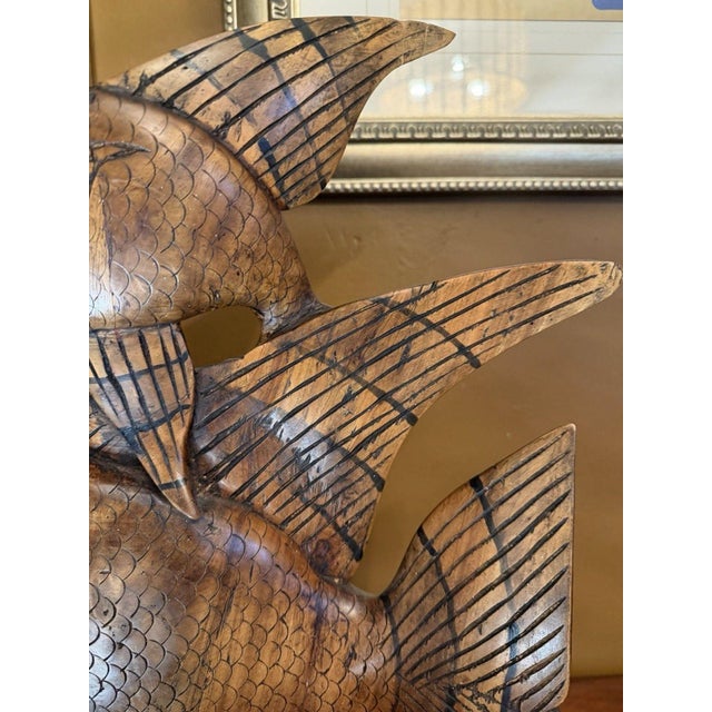 This vintage Indonesian angelfish sculpture, hand-carved in the 1950s, is a striking example of mid-century tropical folk...