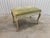 Classic 1960’s-1970’s French provincial boudoir bench from Hibriten Furniture Co. Simple creamy off white finish on a...