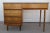 Vintage Mid Century Modern 4 Drawer Walnut Student / Writing Desk. The desk is veneered in walnut, has 4 drawers and 6...