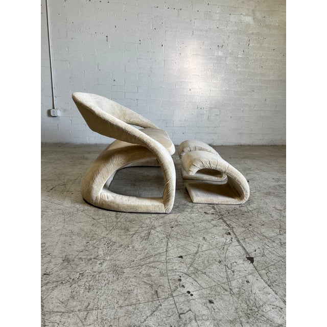 Vintage postmodern loveseat upholstered featuring curved lines, soft velvet fabric and two matching ottomans. In excellent...