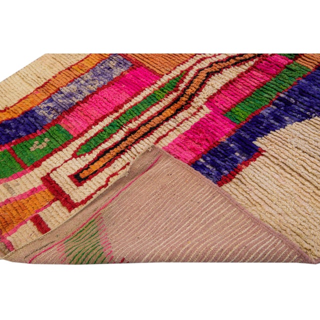 Beautiful vintage Beni Ourain Moroccan handmade wool rug. This full-of-art Moroccan rug has an abstract pattern with a...