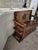 This piece is an antique English Jacobean Revival style monk's bench (also known as a settle bench,) likely crafted in the...