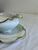 An elegant antique gravy boat by Haviland & Co. Limoges, featuring a scalloped wavy rim with hand-applied gold trim and a...