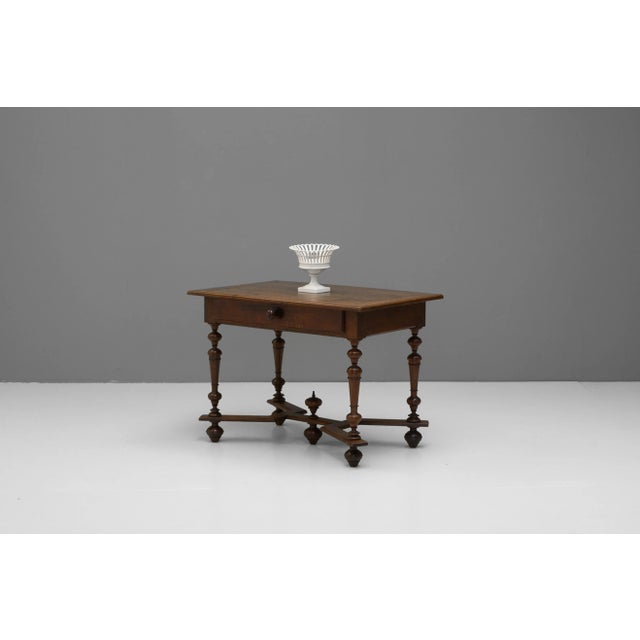 French single drawer side table in chestnut with shaped stretchers. Circa 1850.