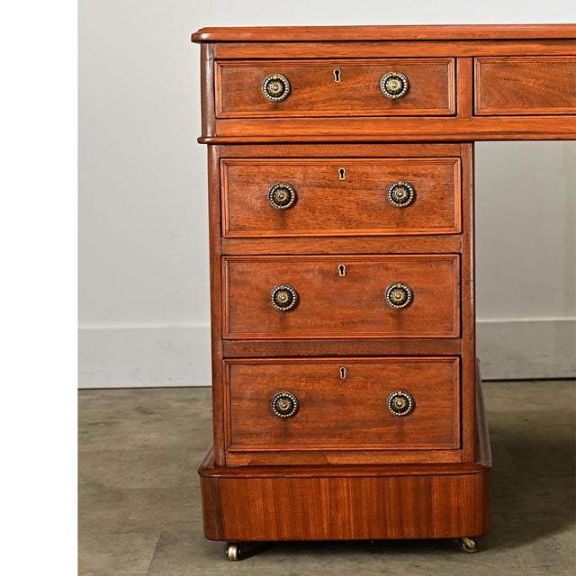 Two people can comfortably use this remarkable French 19th century mahogany partner's desk, that is they are willing to...