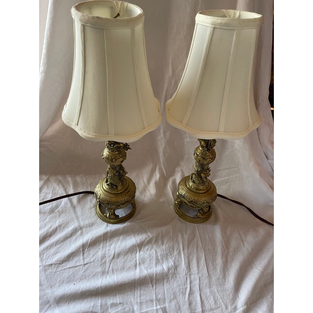 This pair of beautiful Chinese hand cast and carved brass lamps was made for export in the 1950s. Very good vintage...