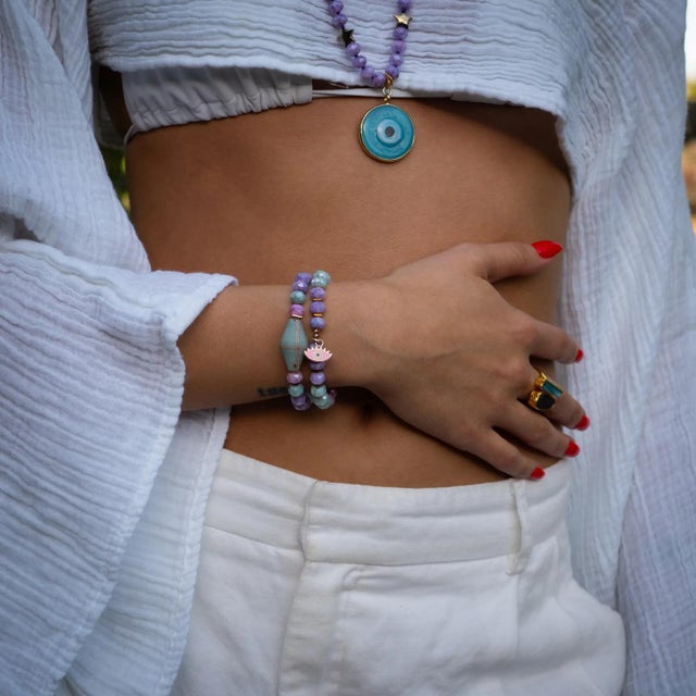 Brighten up your style with the Pastel Colors Beaded Evil Eye Pendant Spring Bracelet Set, designed to bring positivity,...