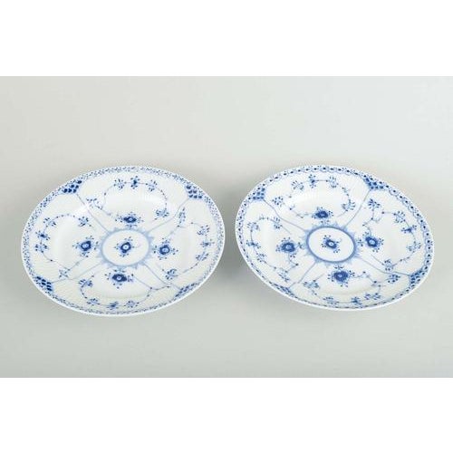Royal Copenhagen Two lunch plates, model 1/572. White porcelain plates with hand-painted blue decoration in the classic...