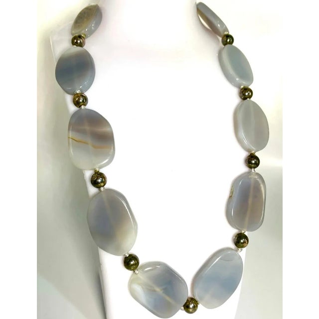 Blue Lace Agate has been prized for its delicate banding and soothing blue-gray coloration since ancient times. This semi-...