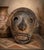 A wonderfully sculptural vintage Peruvian pottery mask with an expressive elongated face and richly textured, smoke-...