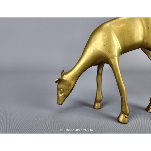 Vintage Solid Brass Deer Statue This deer figurine is made from solid brass and shows light natural patina from the age....