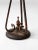 This is an antique cast iron standing ashtray. The decorative ashtray stand features a floral motif base with painted...