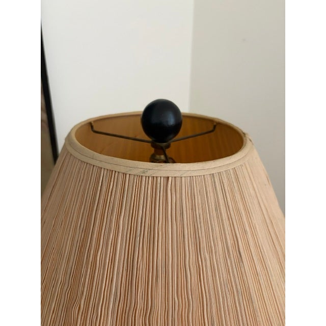 Add warmth and sophistication to any room with this striking vintage brass table lamp featuring a beautifully sculpted...