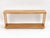 A long narrow cane and walking stick display case or storage rack with two-tiers of maple wooden racks with two horizontal...