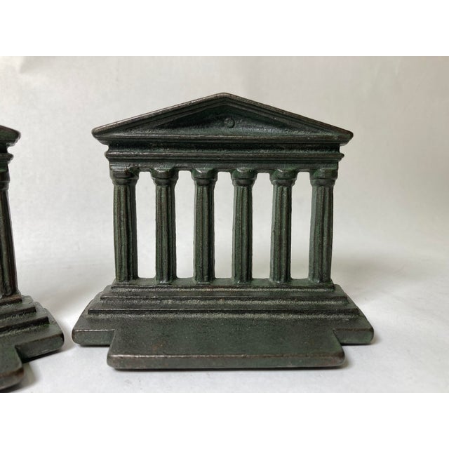Lovely pair of Parthenon bookends with a green faux patina. I love the simple lines, fine casting and beautiful green patina.