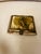 A striking decorative keepsake box clad in natural bone panels and accented with ornate brass trim and hardware. The lid...