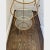 Gorgeous vintage Italian Hollywood Regency style gilt metal / tole etagere. With four tiers and glass shelves, this piece...