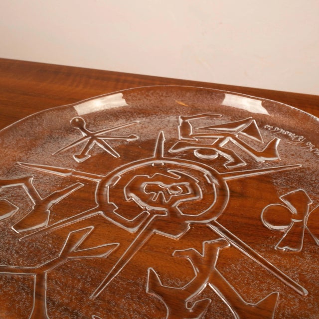 An extraordinary engraved glass plate-sculpture, signed by Arnaldo Pomodoro, one of the most important figures in...