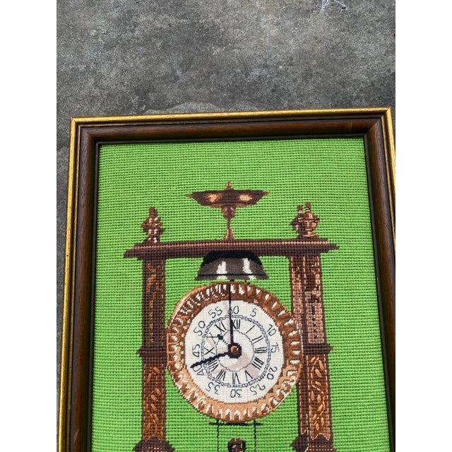 Clock With Man on Pendulum Needlepoint. Vibrant, intricate needlepoint depicting a man on clock pendulum. Needlepoint is...