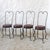 Four ice cream parlor or bistro chairs. Wrought iron, heart-shaped backrest. In some areas, the iron is twisted, creating...
