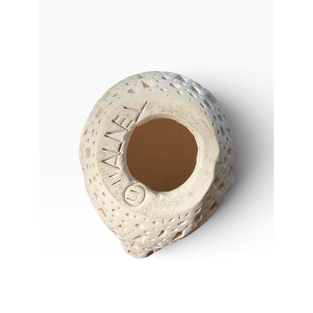 Alexander Ney (Russian-American, 1939–2023), untitled perforated terracotta head, circa 1980s. A compact sculptural head...