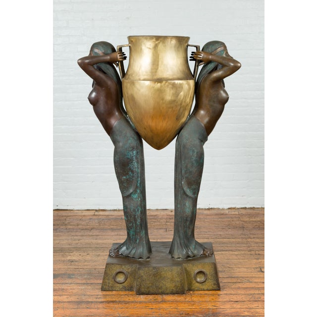 Bronze Egyptian Style Planter Depicting Two Maiden Carrying a Large Golden Urn For Sale - Image 4 of 12