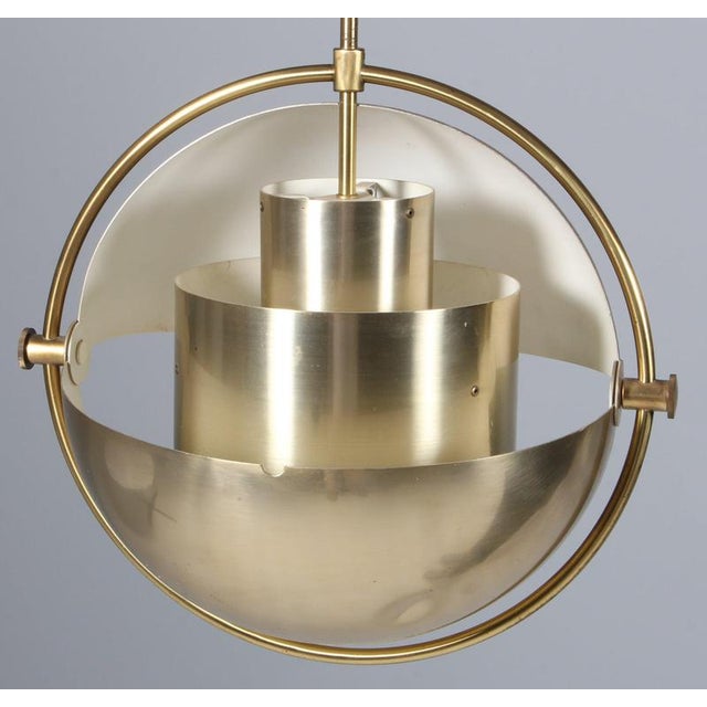 Rare original production brass multi-lite pendant by Louis Weisdorf for Lyfa, Denmark. This piece is attributed to the...