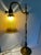 Antique Adjustable Brass Table Lamp With Tiffany Style Shade. Originally from France around the 1930's this lamp was...