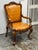 Design Plus Gallery presents a Vintage Venetian Leather Carved Wood Armchair. The armchair showcases an ornate wood frame...