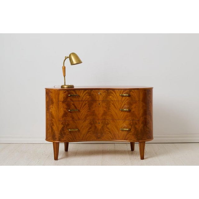 Swedish modern Axel Larsson bureau made by AB Svenska Möbelfabrikerna, Bodafors. This kidney shaped bureau was made during...