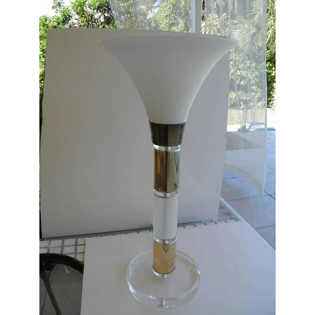 This is a large cool Mid-Century 1960s modern clear and frosted Lucite and brass banded Lamp with a frosted urn shape...