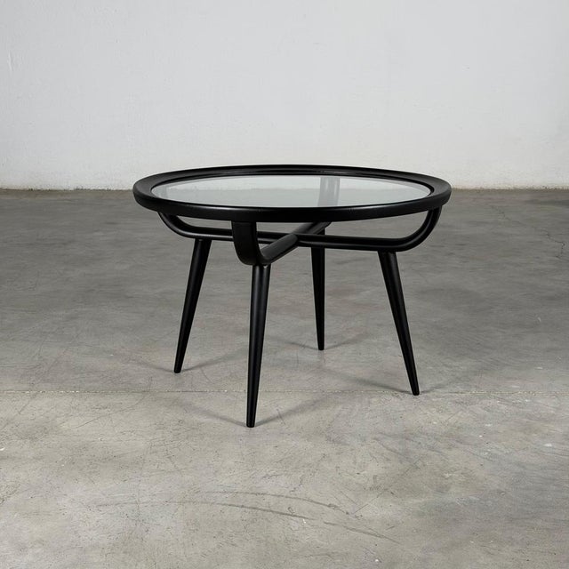 Striking round coffee table designed by Nicolas Diulgheroff in the 1950s, newly refinished in a sophisticated semi-matte...