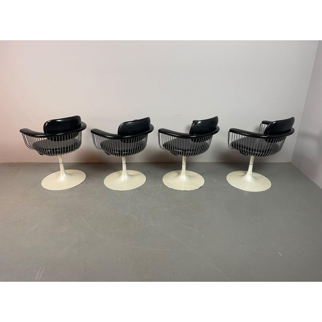 A striking set of four vintage swivel dining chairs attributed to rudi verelst for novalux, belgium, dating from the...