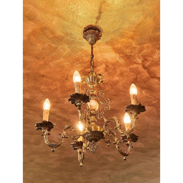 This elegant historical chandelier is made of high-quality brass combined with decorative onyx. Its richly decorated arms...