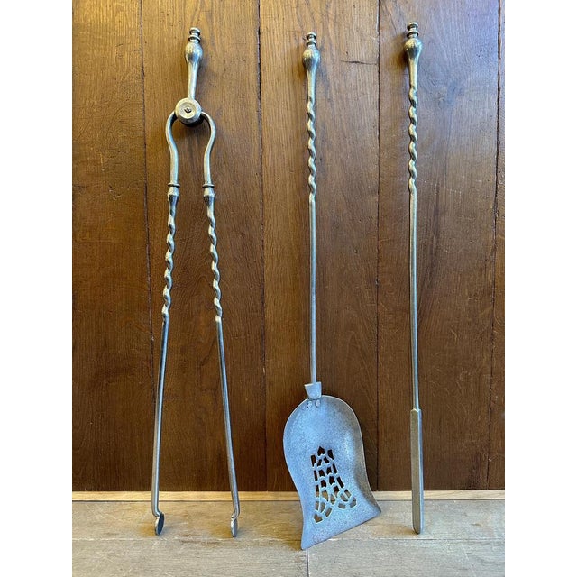 A set of polished barley twist fire irons/tools from the early to mid 19th century. In good order with finial handles,...
